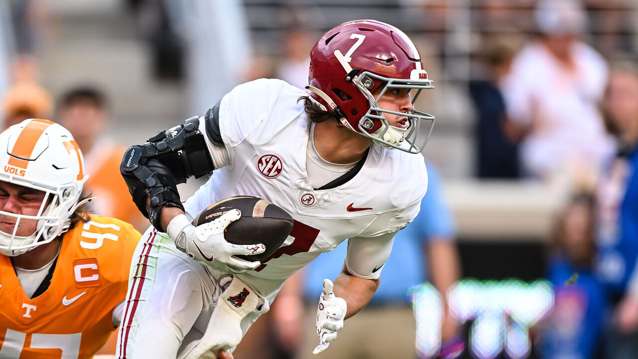 KNOXVILLE, TN - OCTOBER 19: Alabama Crimson Tide wide receiver Cole Adams (7) is tripped up by Tennessee Volunteers long snapper Matthew Salansky (47) during the college football game between the Tennessee Volunteers and the Alabama Crimson Tide on October 19, 2024, at Neyland Stadium in Knoxville, TN.