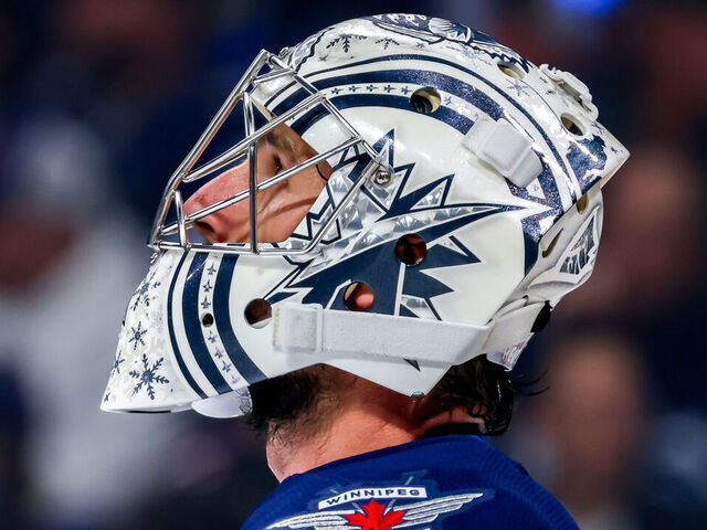 WINNIPEG, CANADA - OCTOBER 28: Goaltender Connor Hellebuyck #37 of the Winnipeg Jets looks on during a first period stoppage of play against the Toronto Maple Leafs at Canada Life Centre on October 28, 2024 in Winnipeg, Manitoba, Canada.