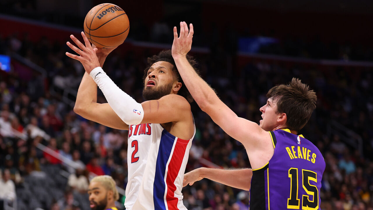 DETROIT, MICHIGAN - NOVEMBER 04: Cade Cunningham #2 of the Detroit Pistons shoots the ball past Austin Reaves #15 of the Los Angeles Lakers during the fourth quarter at Little Caesars Arena on November 04, 2024 in Detroit, Michigan. NOTE TO USER: User expressly acknowledges and agrees that, by downloading and/or using this photograph, user is consenting to the terms and conditions of the Getty Images License Agreement.