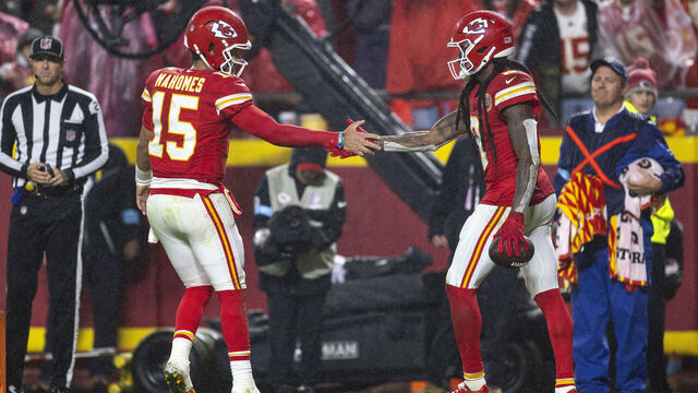 KANSAS CITY, MISSOURI - NOVEMBER 4: DeAndre Hopkins #8 of the Kansas City Chiefs celebrates with his teammate Patrick Mahomes #15 of the Kansas City Chiefs after scoring a touchdown during an NFL Football game against the Tampa Bay Buccaneers at GEHA Field at Arrowhead Stadium on November 04, 2024 in Kansas City, Missouri.