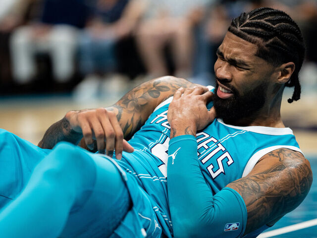 CHARLOTTE, NORTH CAROLINA - NOVEMBER 01: Nick Richards #4 of the Charlotte Hornets is shaken up after a play during their game against the Boston Celtics at Spectrum Center on November 01, 2024 in Charlotte, North Carolina.
