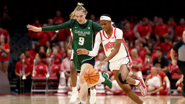 COLUMBUS, OHIO - NOVEMBER 5: Kennedy Cambridge #3 of the Ohio State Buckeyes pushes the ball up the court against the defense of Sarah Hurley #9 of the Cleveland State Vikings during the fourth quarter of the game at Value City Arena on November 5, 2024 in Columbus, Ohio. Ohio State defeated Cleveland State 104-69.