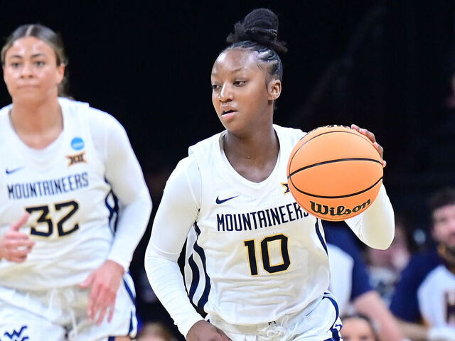 IOWA CITY, IA - MARCH 23: dWest Virginia guard Jordan Harrison (10) brings the ball up the court during the Princeton Tigers game versus the West Virginia Mountaineers in the first round of the NCAA Division I Women's Championship on March 23, 2024, at Carver-Hawkeye Arena in Iowa City, IA.