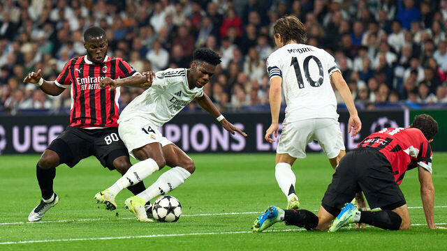 MADRID, SPAIN - NOVEMBER 05: Aurelien Tchouameni of Real Madrid is challenged by Yunus Musah of AC Milan during the UEFA Champions League 2024/25 League Phase MD4 match between Real Madrid C.F. and AC Milan at Estadio Santiago Bernabeu on November 05, 2024 in Madrid, Spain.