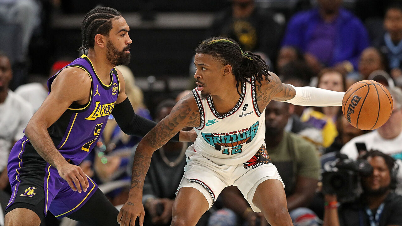 MEMPHIS, TENNESSEE - NOVEMBER 06: Ja Morant #12 of the Memphis Grizzlies looks for an opening against Gabe Vincent #7 of the Los Angeles Lakers during the first half at FedExForum on November 06, 2024 in Memphis, Tennessee.