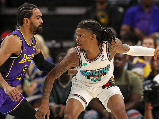 MEMPHIS, TENNESSEE - NOVEMBER 06: Ja Morant #12 of the Memphis Grizzlies looks for an opening against Gabe Vincent #7 of the Los Angeles Lakers during the first half at FedExForum on November 06, 2024 in Memphis, Tennessee.