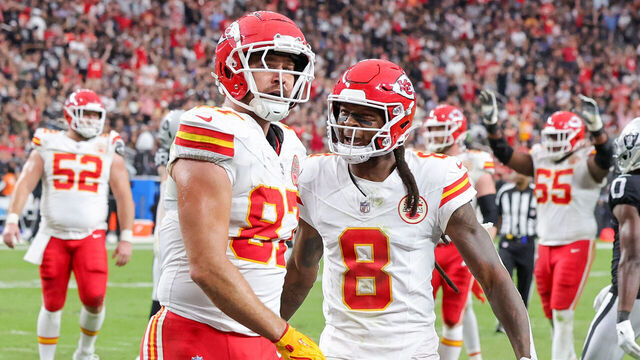LAS VEGAS, NEVADA - OCTOBER 27: Travis Kelce #87 and DeAndre Hopkins #8 of the Kansas City Chiefs celebrate Kelce's 5-yard touchdown reception against the Las Vegas Raiders in the second quarter of their game at Allegiant Stadium on October 27, 2024 in Las Vegas, Nevada. The Chiefs defeated the Raiders 27-20.