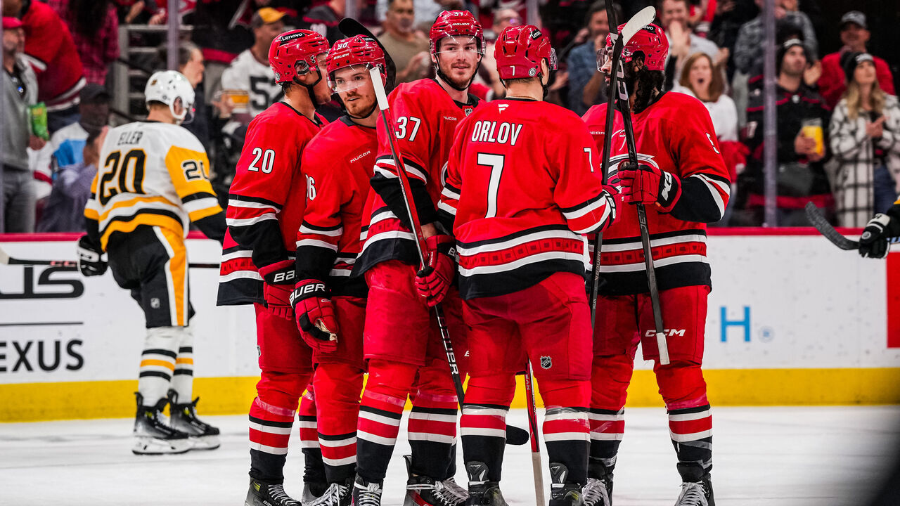 RALEIGH, NORTH CAROLINA - NOVEMBER 07: Jack Roslovic #96 of the Carolina Hurricanes celebrates with teammates after a goal during the second period against the Pittsburgh Penguins at Lenovo Center on November 7, 2024 in Raleigh, North Carolina.