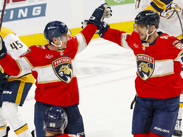 SUNRISE, FL - NOVEMBER 7: Tomas Nosek #92 (L) is congratulated by A.J. Greer #10 of the Florida Panthers after he scored his first goal of the season against the Nashville Predators during third period action at the Amerant Bank Arena on November 7, 2024 in Sunrise, Florida.