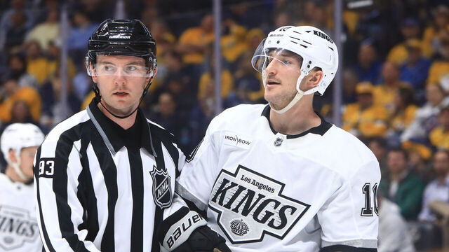 NASHVILLE, TN - NOVEMBER 04: Linesman Kilian McNamara (93) and Los Angeles Kings left wing Tanner Jeannot (10) are shown during the NHL game between the Nashville Predators and Los Angeles Kings, held on November 4, 2024, at Bridgestone Arena in Nashville, Tennessee.
