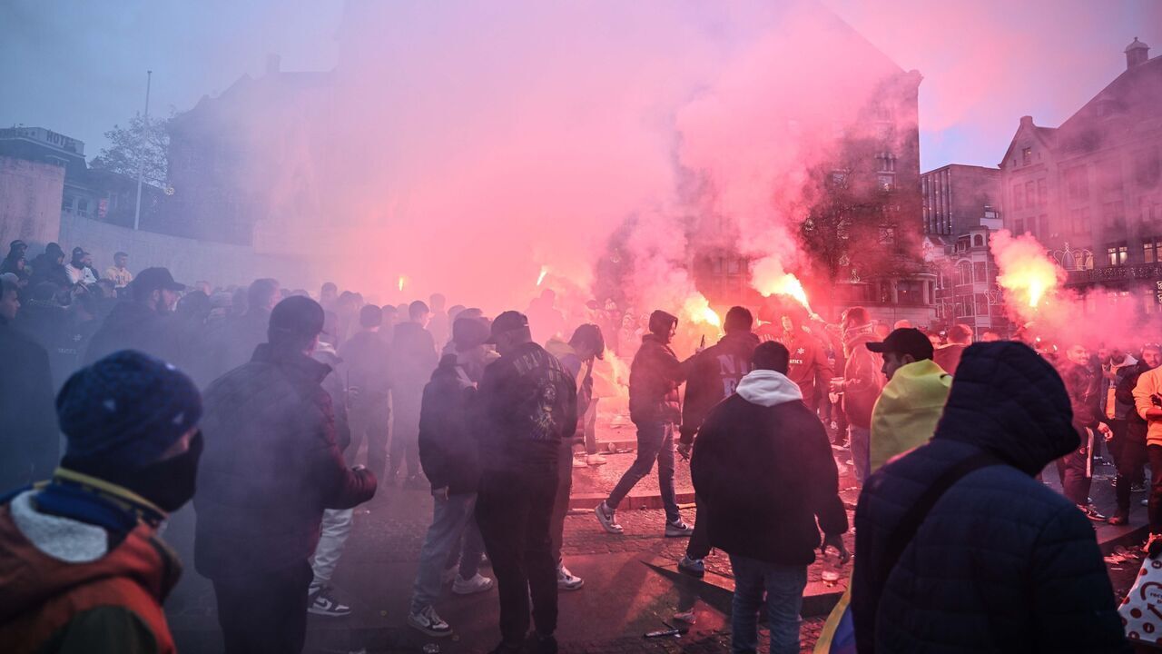 AMSTERDAM, NETHERLANDS - NOVEMBER 7: Fans of Maccabi Tel Aviv stage a pro-Israel demonstration at the Dam Square, lighting up flares and chanting slogans ahead of the UEFA Europa League match between Maccabi Tel Aviv and Ajax in Amsterdam, Netherlands on November 07, 2024. Maccabi fans clashed with pro-Palestinian citizens and ripped off Palestinian flags hung on the streets. In the lead-up to the Ajax vs Maccabi Tel Aviv match, several areas of Amsterdam have been designated as security risk zones.