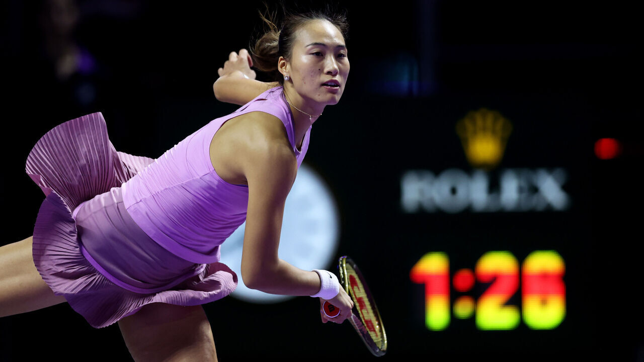 RIYADH, SAUDI ARABIA - NOVEMBER 08: Qinwen Zheng of China serves against Barbora Krejcikova of Czechia in their Women's Semifinal singles match during Day 7 of the 2024 WTA Finals Riyadh as part of the Hologic WTA Tour at King Saud University Indoor Arena on November 08, 2024 in Riyadh, Saudi Arabia.