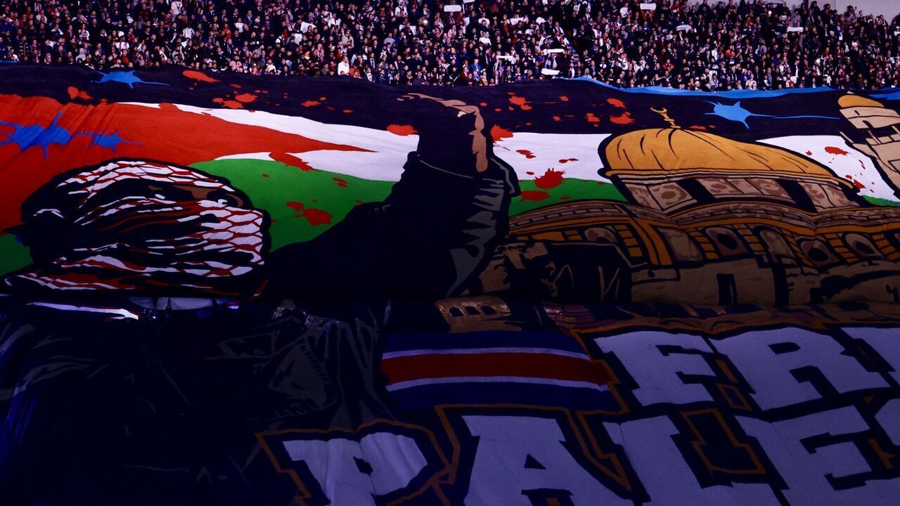 PARIS, FRANCE - NOVEMBER 6: Fans unfurl a banner reading 'Free Palestine' ahead of the UEFA Champions League, League Phase - Matchday 4, football match between Paris Saint-Germain (PSG) and Atletico Madrid at the Parc des Princes stadium in Paris, France, on November 6, 2024.