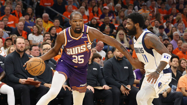 PHOENIX, ARIZONA - OCTOBER 26: Kevin Durant #35 of the Phoenix Suns handles the ball against Kyrie Irving #11 of the Dallas Mavericks during the NBA game at Footprint Center on October 26, 2024 in Phoenix, Arizona. The Suns defeated the Mavericks 114-102. NOTE TO USER: User expressly acknowledges and agrees that, by downloading and/or using this photograph, user is consenting to the terms and conditions of the Getty Images License Agreement.
