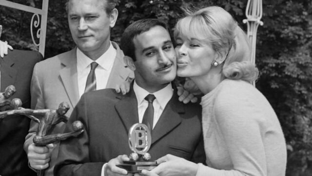 French singer and actress Line Renaud (L) and French television presenter Jacqueline Huet (R) award with the Trophées UNFP du football, previously called Oscars du football, footballers Yvon Goujon (2ndL) and Rachid Mekhloufi (2ndR), on June 13, 1967 at the Pavillon d'Armenonville, as team manager Jean Snella (C) looks on.