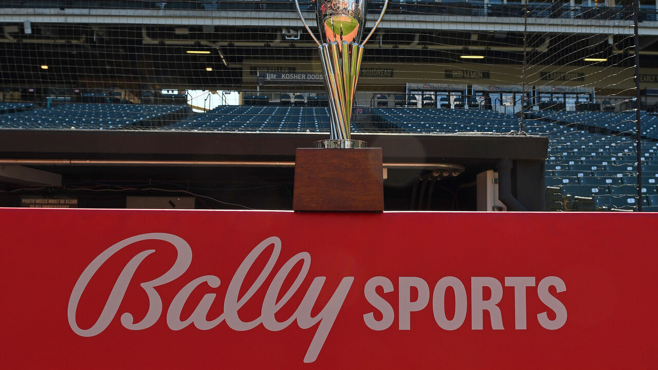 CLEVELAND, OH - MAY 17, 2022: The Ohio Cup Trophy on top of a Bally Sports logo prior to a game between the Cincinnati Reds and Cleveland Guardians at Progressive Field on May 17, 2022 in Cleveland, Ohio.