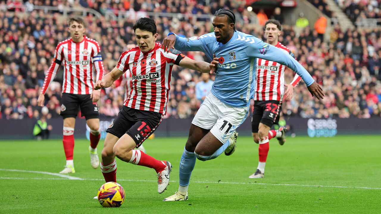 Coventry City's Haji Wright (right) and Sunderland's Luke O'Nien battle for the ball during the Sky Bet Championship match at the Stadium of Light, Sunderland. Picture date: Saturday November 9, 2024.
