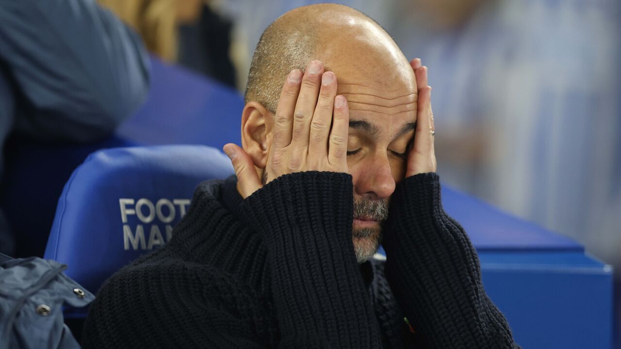BRIGHTON, ENGLAND - NOVEMBER 9: Josep Guardiola Manager of Manchester City looks disappointed & dejected during the Premier League match between Brighton & Hove Albion FC and Manchester City FC at Amex Stadium on November 9, 2024 in Brighton, England.