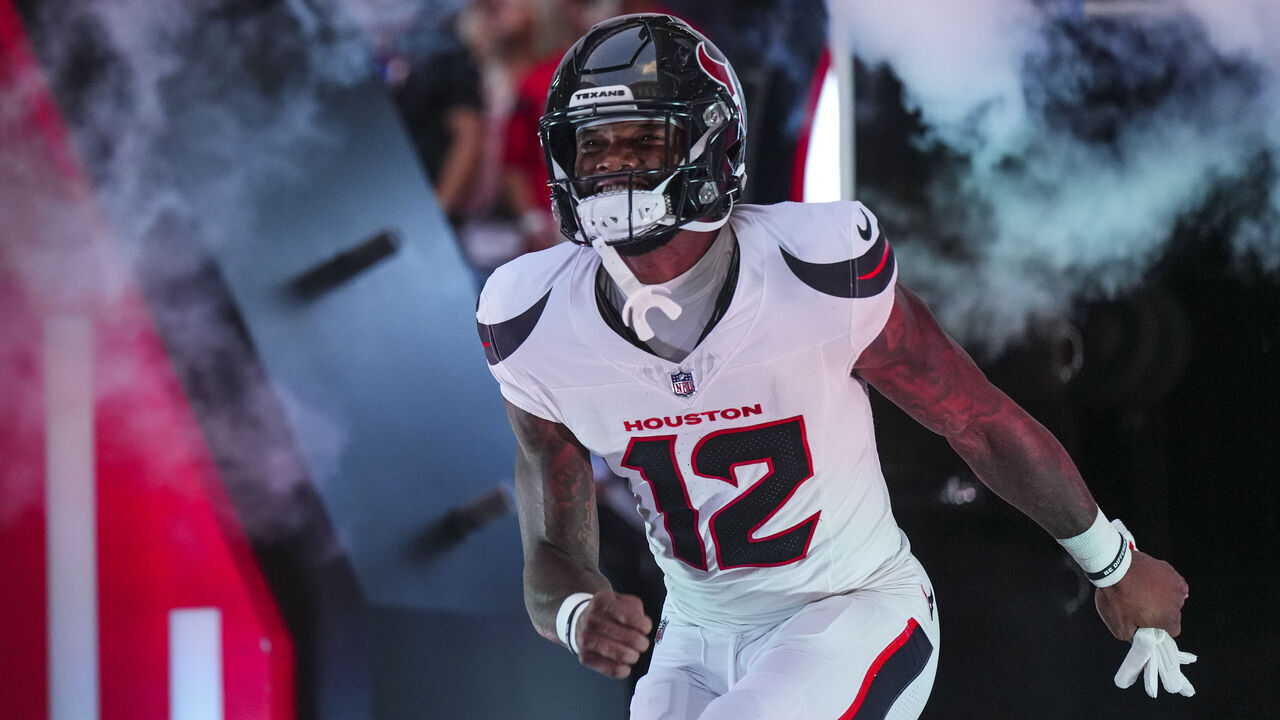 HOUSTON, TX - SEPTEMBER 15: Nico Collins #12 of the Houston Texans runs out of the tunnel prior to an NFL football game against the Chicago Bears during a football game at NRG Stadium on September 15, 2024 in Houston, Texas.