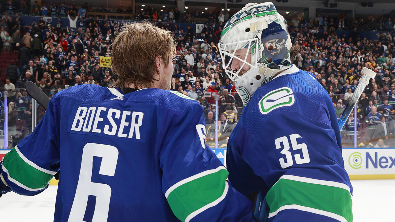 VANCOUVER, CANADA - FEBRUARY 24: Brock Boeser #6 and Thatcher Demko #35 of the Vancouver Canucks celebrate their NHL game win against the Boston Bruins at Rogers Arena on February 24, 2024 in Vancouver, British Columbia, Canada. Vancouver won 3-2.