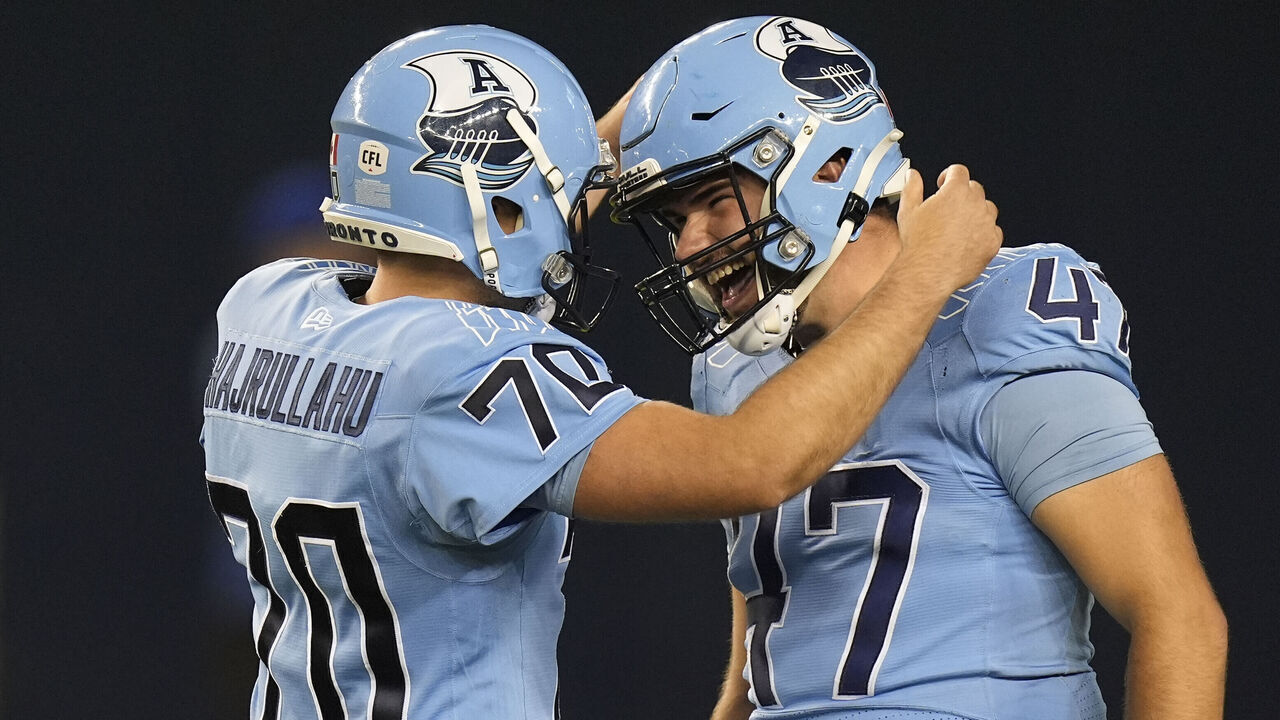TORONTO, CANADA - SEPTEMBER 20: Adam Guillemette #47 and Lirim Hajrullahu #70 of the Toronto Argonauts celebrate a successful field goal against the Hamilton Tiger-Cats at BMO Field on September 20, 2024 in Toronto, Canada.