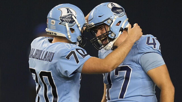 TORONTO, CANADA - SEPTEMBER 20: Adam Guillemette #47 and Lirim Hajrullahu #70 of the Toronto Argonauts celebrate a successful field goal against the Hamilton Tiger-Cats at BMO Field on September 20, 2024 in Toronto, Canada.