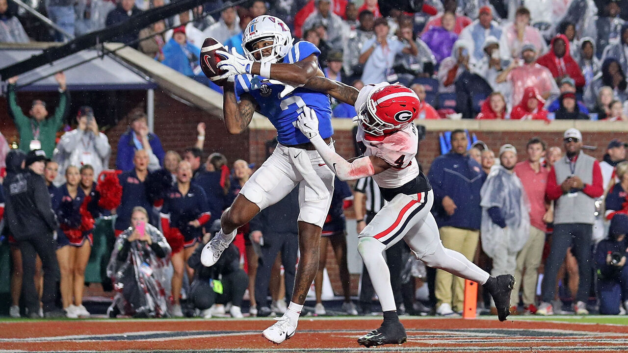 OXFORD, MISSISSIPPI - NOVEMBER 09: Antwane Wells Jr. #3 of the Mississippi Rebels catches a pass for a touchdown during the second half against KJ Bolden #4 of the Georgia Bulldogs at Vaught-Hemingway Stadium on November 09, 2024 in Oxford, Mississippi. Ole Miss defeated Georgia 28-10.
