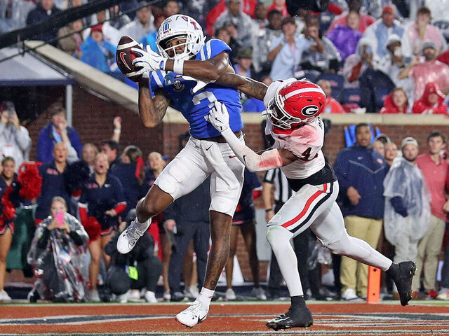 OXFORD, MISSISSIPPI - NOVEMBER 09: Antwane Wells Jr. #3 of the Mississippi Rebels catches a pass for a touchdown during the second half against KJ Bolden #4 of the Georgia Bulldogs at Vaught-Hemingway Stadium on November 09, 2024 in Oxford, Mississippi. Ole Miss defeated Georgia 28-10.