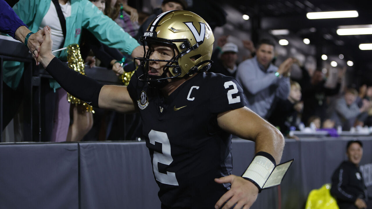 NASHVILLE, TN - NOVEMBER 09: Vanderbilt Commodores quarterback Diego Pavia (2) hives high fives to the crowd after scoring a touchdown during a game between the Vanderbilt Commodores and South Carolina Gamecocks, November 9, 2024 at FirstBank Stadium in Nashville, Tennessee.