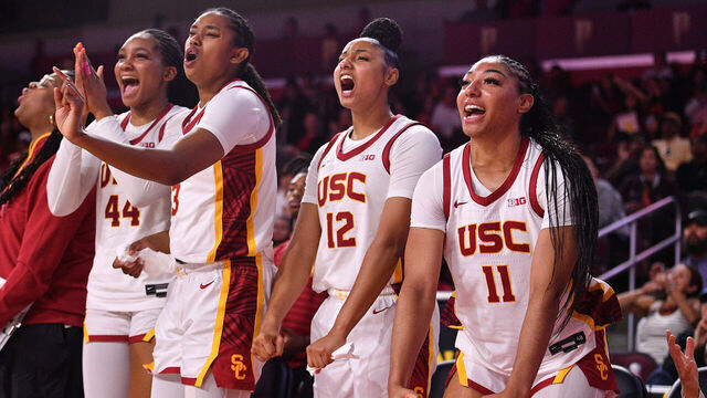 LOS ANGELES, CA - NOVEMBER 09: USC Trojans forward Kiki Iriafen (44), USC Trojans forward Rayah Marshall (13), USC Trojans guard JuJu Watkins (12) and USC Trojans guard Kennedy Smith (11) celebrate on the bench during the women's college basketball game between the Cal Poly Mustangs and the USC Trojans on November 9, 2024 at Galen Center in Los Angeles, CA.