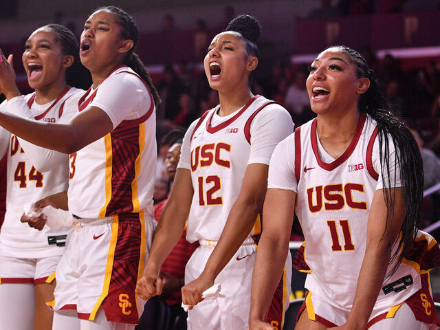 LOS ANGELES, CA - NOVEMBER 09: USC Trojans forward Kiki Iriafen (44), USC Trojans forward Rayah Marshall (13), USC Trojans guard JuJu Watkins (12) and USC Trojans guard Kennedy Smith (11) celebrate on the bench during the women's college basketball game between the Cal Poly Mustangs and the USC Trojans on November 9, 2024 at Galen Center in Los Angeles, CA.