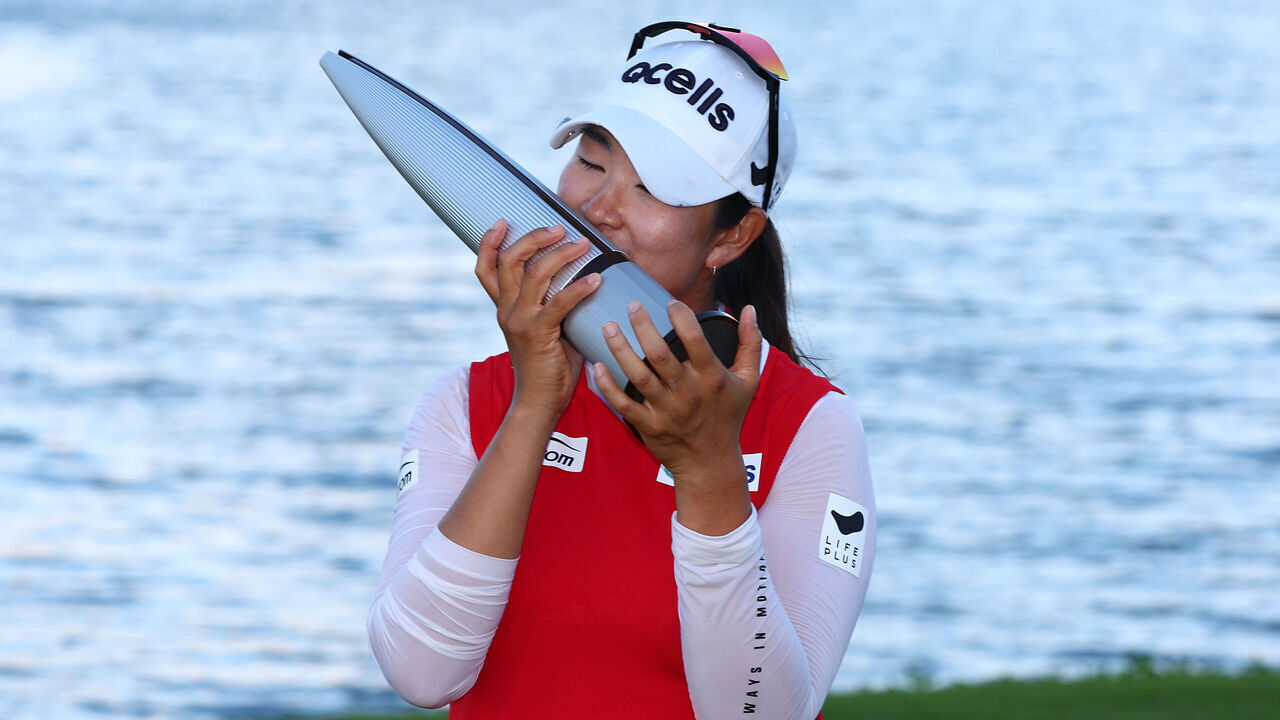 EWA BEACH, HAWAII - NOVEMBER 09: A Lim Kim of South Korea celebrates with the trophy after winning the LOTTE Championship presented by Hoakalei 2024 at Hoakalei Country Club on November 09, 2024 in Ewa Beach, Hawaii.