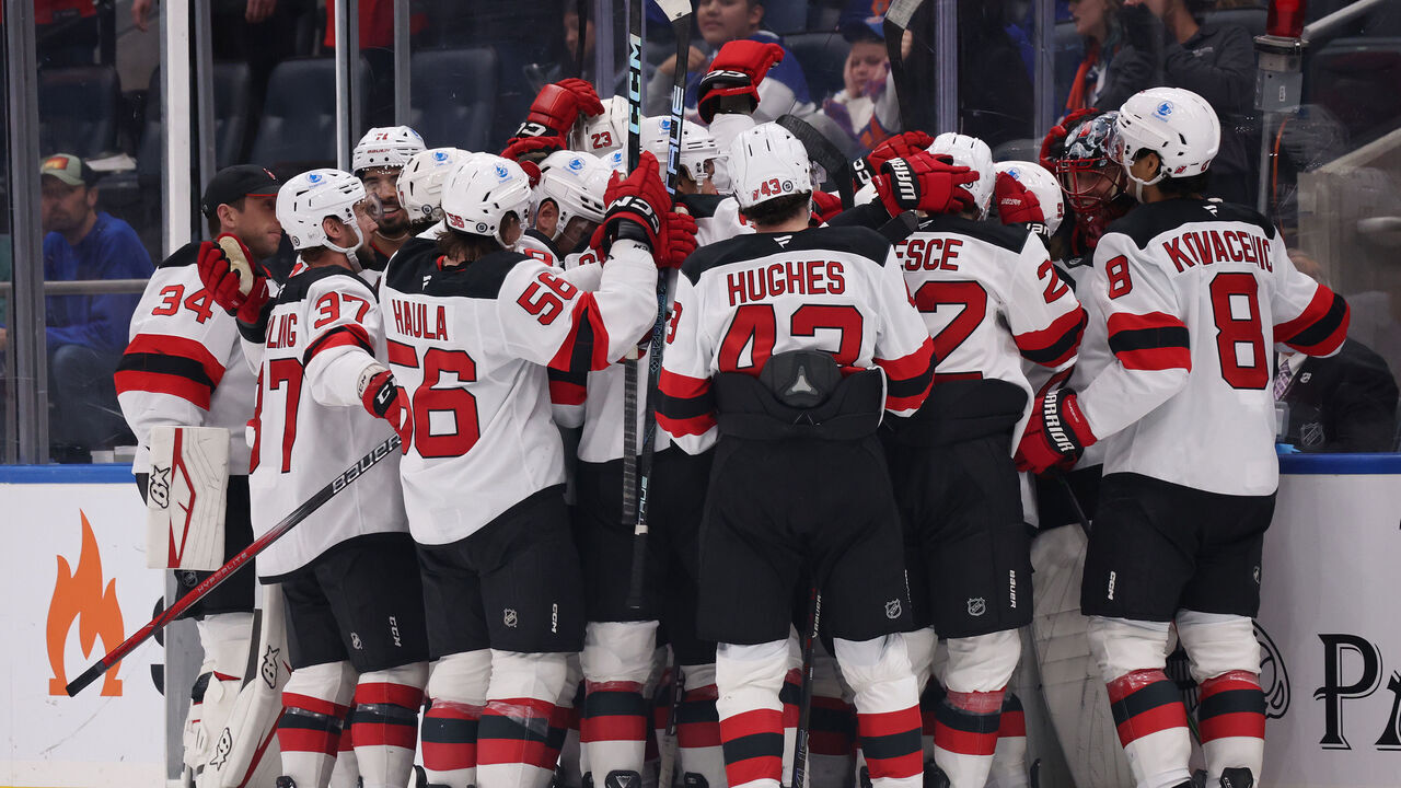 ELMONT, NEW YORK - NOVEMBER 09: Jack Hughes #86 of the New Jersey Devils celebrates after scoring the winning overtime goal against the New York Islanders during their game at UBS Arena on November 09, 2024 in Elmont, New York.