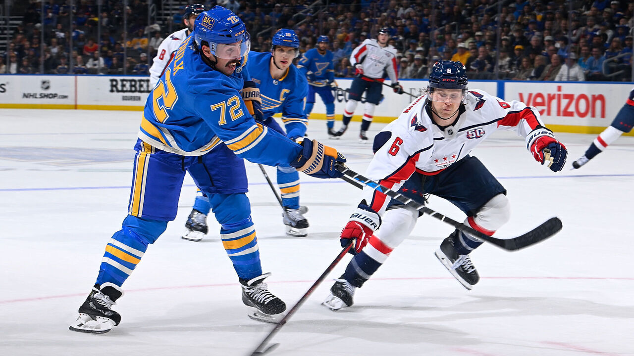 ST. LOUIS, MO - NOVEMBER 9: Justin Faulk #72 of the St. Louis Blues takes a shot as Jakob Chychrun #6 of the Washington Capitals defends on November 9, 2024 at the Enterprise Center in St. Louis, Missouri.