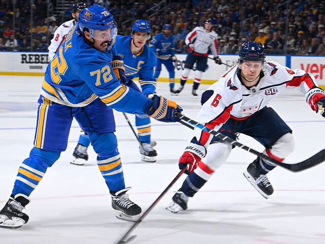 ST. LOUIS, MO - NOVEMBER 9: Justin Faulk #72 of the St. Louis Blues takes a shot as Jakob Chychrun #6 of the Washington Capitals defends on November 9, 2024 at the Enterprise Center in St. Louis, Missouri.