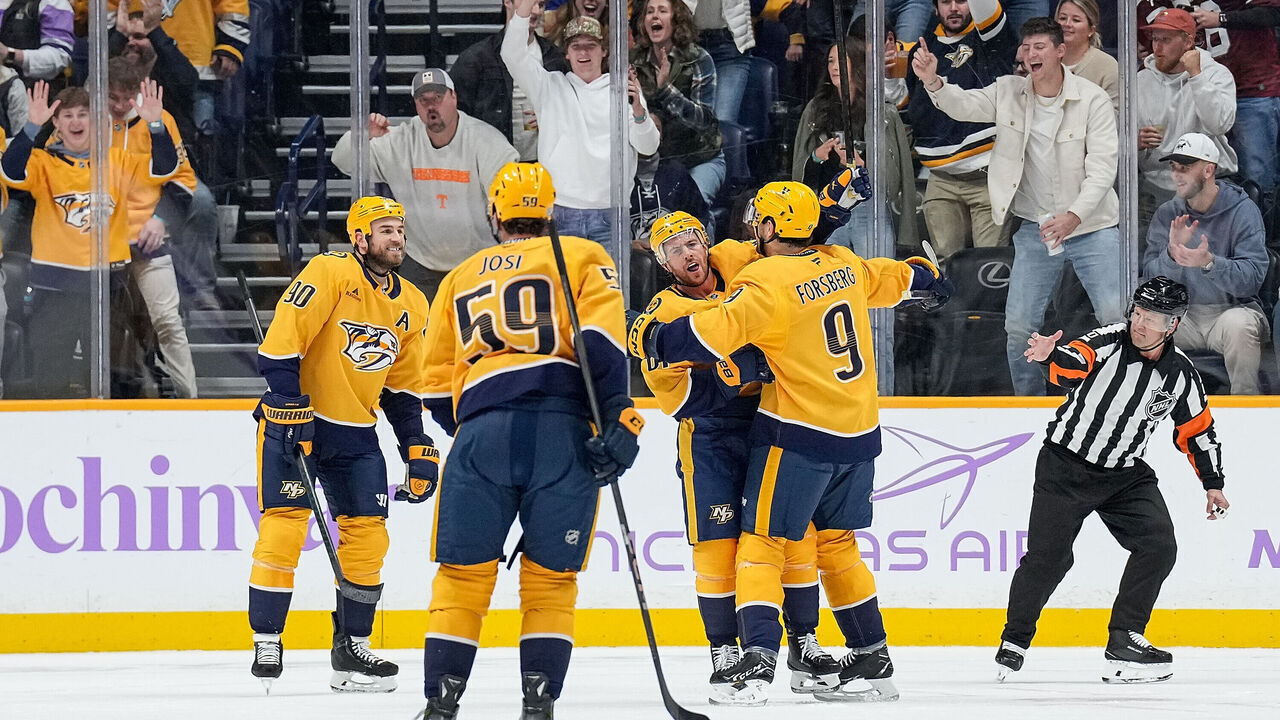 NASHVILLE, TENNESSEE - NOVEMBER 9: Jonathan Marchessault #81 celebrates his goal with Filip Forsberg #9 of the Nashville Predators against the Utah Hockey Club during an NHL game at Bridgestone Arena on November 9, 2024 in Nashville, Tennessee.