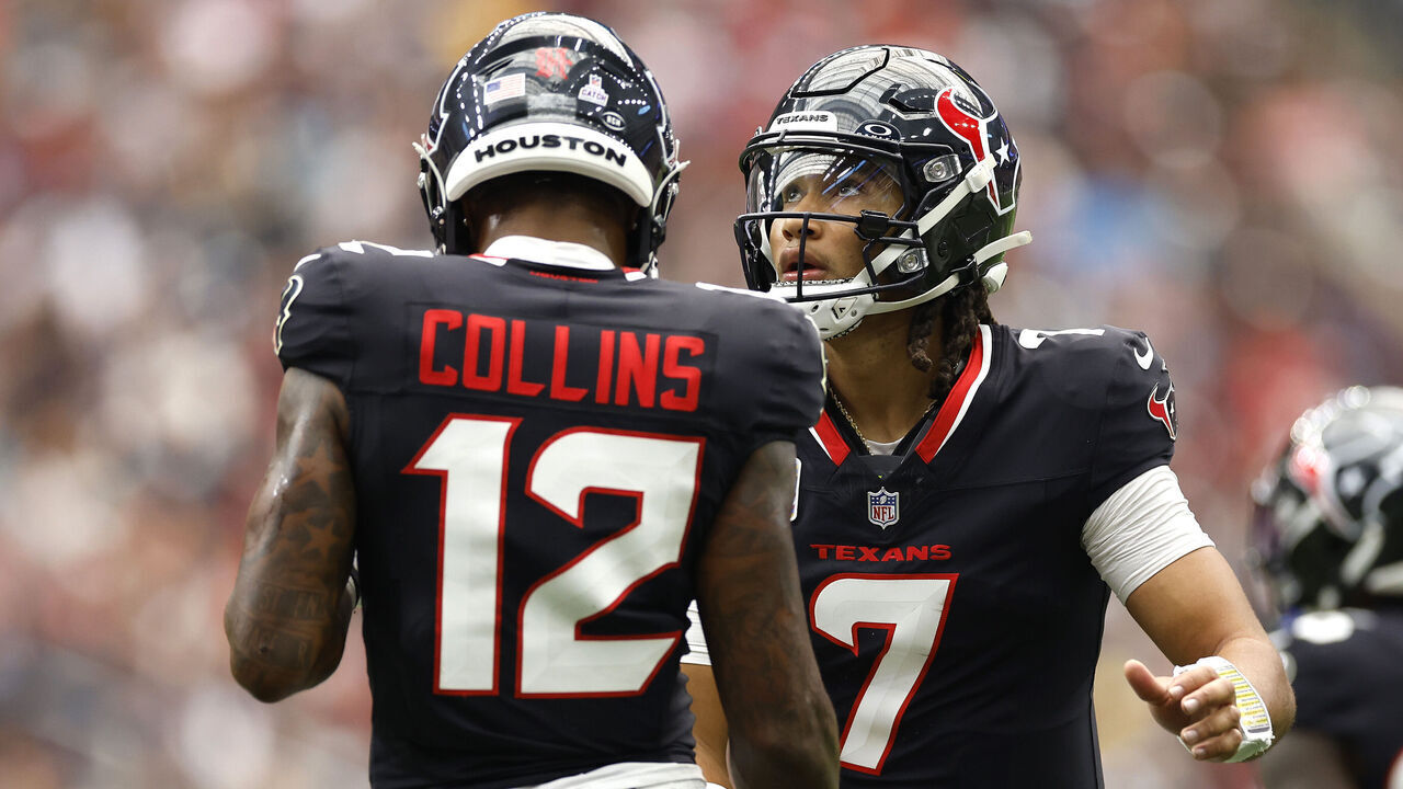 HOUSTON, TEXAS - SEPTEMBER 29: C.J. Stroud #7 and Nico Collins #12 of the Houston Texans high five during the second quarter of the game against the Jacksonville Jaguars at NRG Stadium on September 29, 2024 in Houston, Texas.