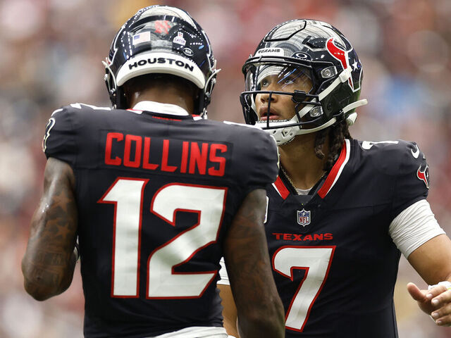 HOUSTON, TEXAS - SEPTEMBER 29: C.J. Stroud #7 and Nico Collins #12 of the Houston Texans high five during the second quarter of the game against the Jacksonville Jaguars at NRG Stadium on September 29, 2024 in Houston, Texas.