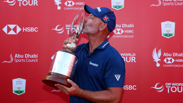 ABU DHABI, UNITED ARAB EMIRATES - NOVEMBER 10: Paul Waring of England kisses the trophy following victory on day four of the Abu Dhabi HSBC Championship 2024 at Yas Links Golf Course on November 10, 2024 in Abu Dhabi, United Arab Emirates.