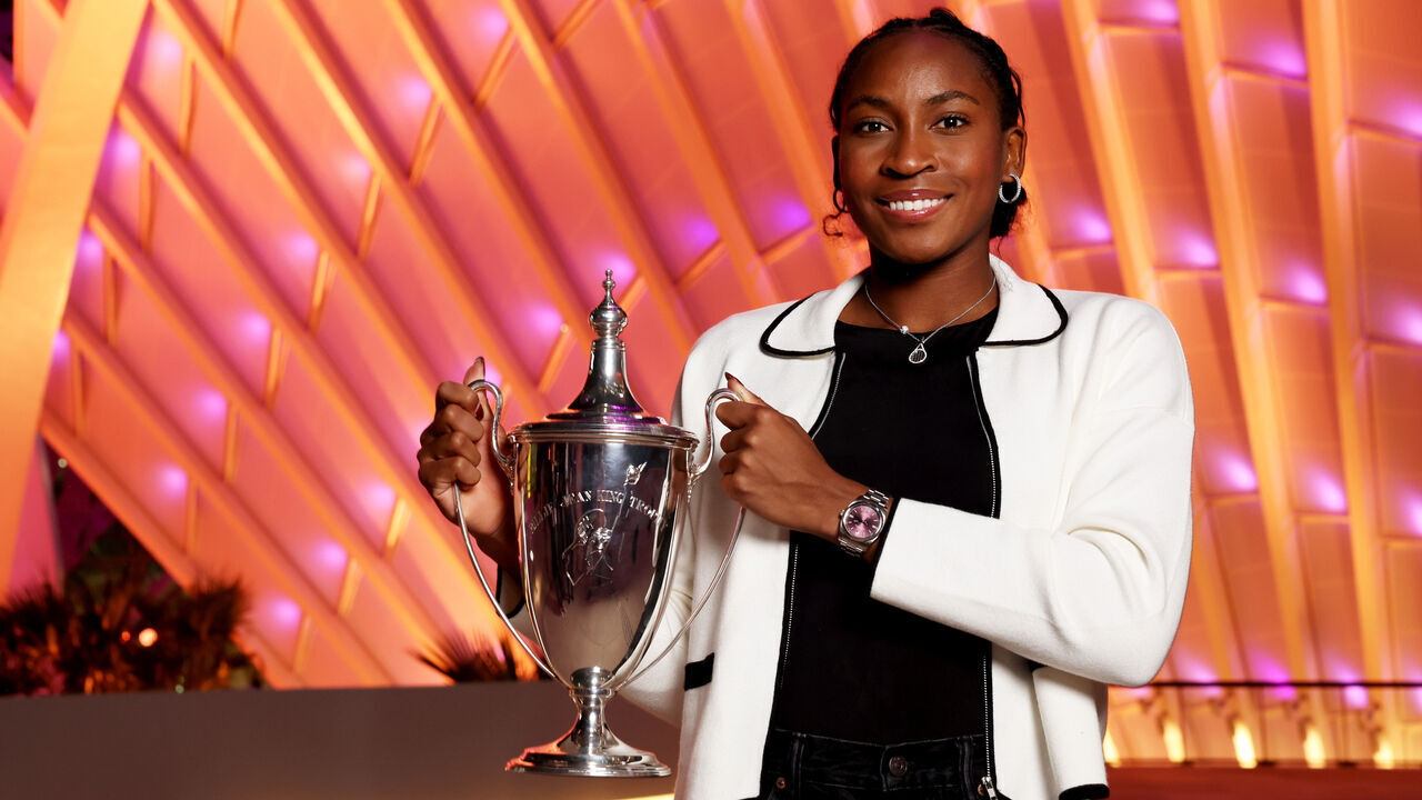 RIYADH, SAUDI ARABIA - NOVEMBER 09: Coco Gauff of the United States holds the Billie Jean King Trophy in front of the King Abdullah Financial District after her three set victory against Qinwen Zheng of China in their Women's Singles Final match during Day 8 of the 2024 WTA Finals Riyadh as part of the Hologic WTA Tour at King Saud University Indoor Arena on November 09, 2024 in Riyadh, Saudi Arabia.