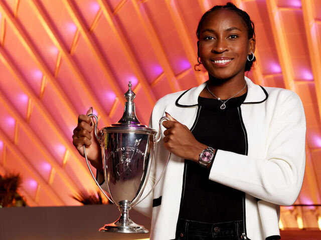RIYADH, SAUDI ARABIA - NOVEMBER 09: Coco Gauff of the United States holds the Billie Jean King Trophy in front of the King Abdullah Financial District after her three set victory against Qinwen Zheng of China in their Women's Singles Final match during Day 8 of the 2024 WTA Finals Riyadh as part of the Hologic WTA Tour at King Saud University Indoor Arena on November 09, 2024 in Riyadh, Saudi Arabia.