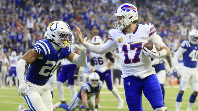 INDIANAPOLIS, INDIANA - NOVEMBER 10: Josh Allen #17 of the Buffalo Bills scores a rushing touchdown past Nick Cross #20 of the Indianapolis Colts during the second quarter at Lucas Oil Stadium on November 10, 2024 in Indianapolis, Indiana.
