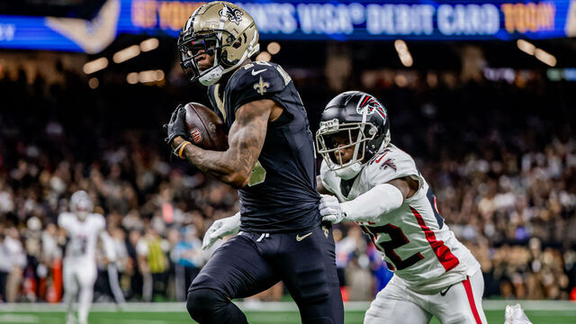 NEW ORLEANS, LOUISIANA - NOVEMBER 10: Marquez Valdes-Scantling #10 of the New Orleans Saints catches a pass over Clark Phillips III #22 of the Atlanta Falcons during the first half of a game at the Caesars Superdome on November 10, 2024 in New Orleans, Louisiana.