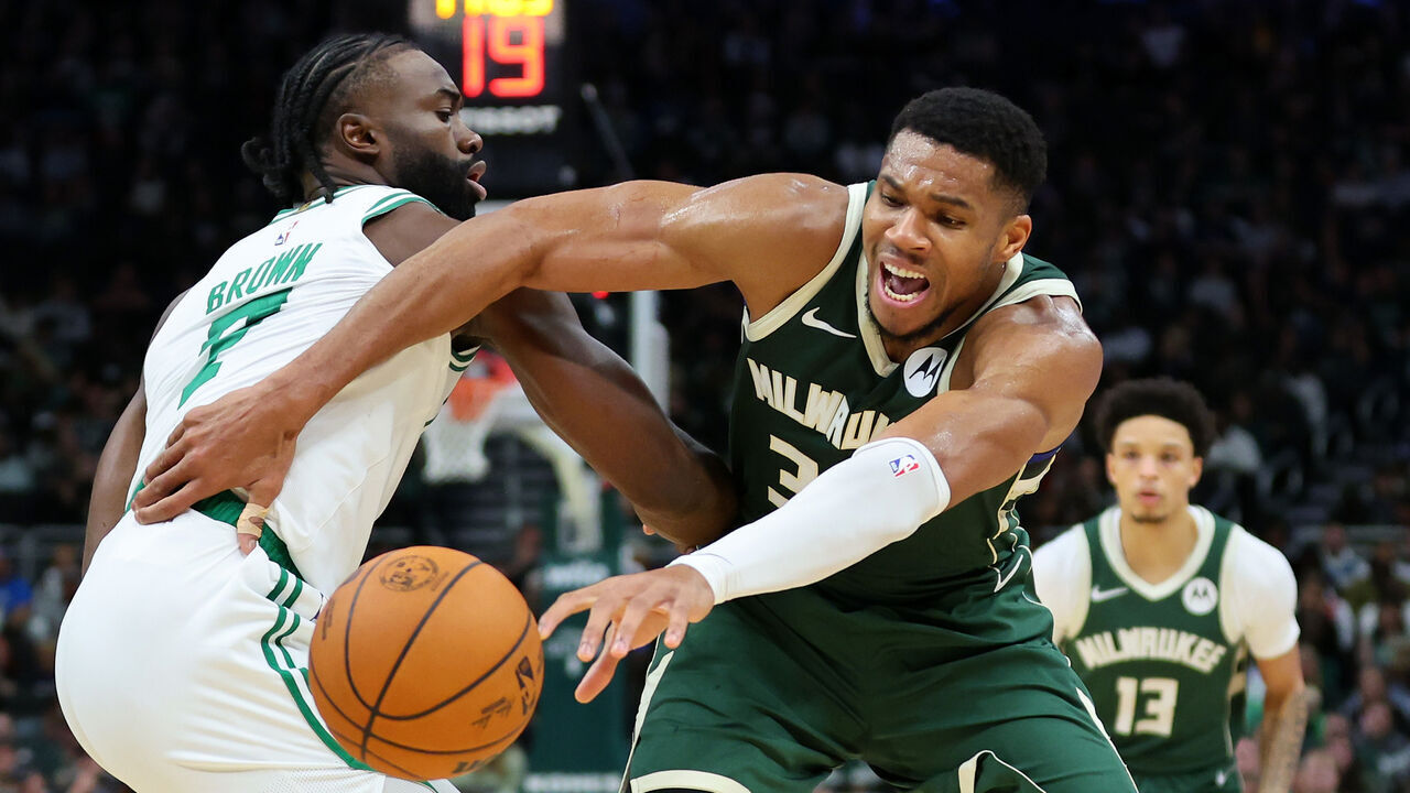 MILWAUKEE, WISCONSIN - NOVEMBER 10: Giannis Antetokounmpo #34 of the Milwaukee Bucks is defended by Jaylen Brown #7 of the Boston Celtics during the first half of a game at Fiserv Forum on November 10, 2024 in Milwaukee, Wisconsin.
