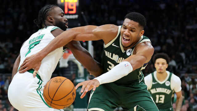 MILWAUKEE, WISCONSIN - NOVEMBER 10: Giannis Antetokounmpo #34 of the Milwaukee Bucks is defended by Jaylen Brown #7 of the Boston Celtics during the first half of a game at Fiserv Forum on November 10, 2024 in Milwaukee, Wisconsin.