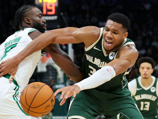 MILWAUKEE, WISCONSIN - NOVEMBER 10: Giannis Antetokounmpo #34 of the Milwaukee Bucks is defended by Jaylen Brown #7 of the Boston Celtics during the first half of a game at Fiserv Forum on November 10, 2024 in Milwaukee, Wisconsin.