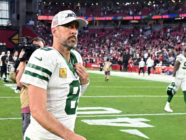 GLENDALE, ARIZONA - NOVEMBER 10: Aaron Rodgers #8 of the New York Jets walks off the field after losing to the Arizona Cardinals 31-6 at State Farm Stadium on November 10, 2024 in Glendale, Arizona.
