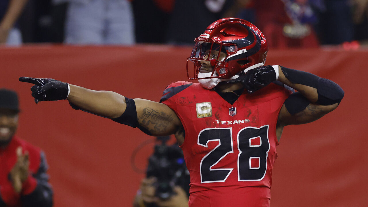 HOUSTON, TEXAS - NOVEMBER 10: Joe Mixon #28 of the Houston Texans reacts after a first down during the first quarter against the Detroit Lions at NRG Stadium on November 10, 2024 in Houston, Texas.
