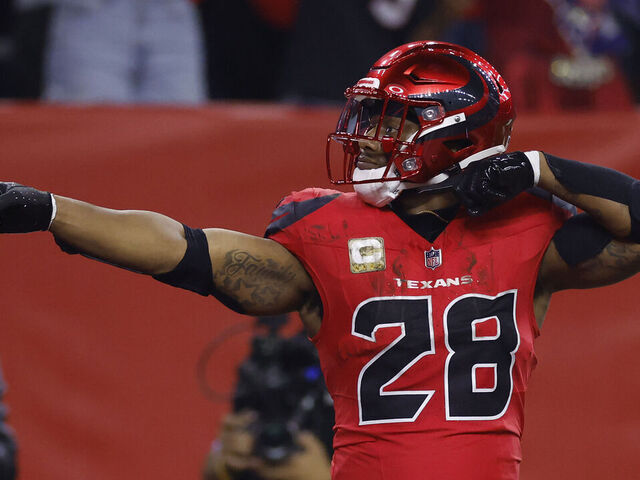HOUSTON, TEXAS - NOVEMBER 10: Joe Mixon #28 of the Houston Texans reacts after a first down during the first quarter against the Detroit Lions at NRG Stadium on November 10, 2024 in Houston, Texas.