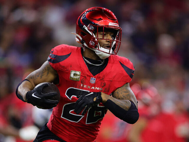 HOUSTON, TEXAS - NOVEMBER 10: Joe Mixon #28 of the Houston Texans runs the ball during the third quarter against the Detroit Lions at NRG Stadium on November 10, 2024 in Houston, Texas.